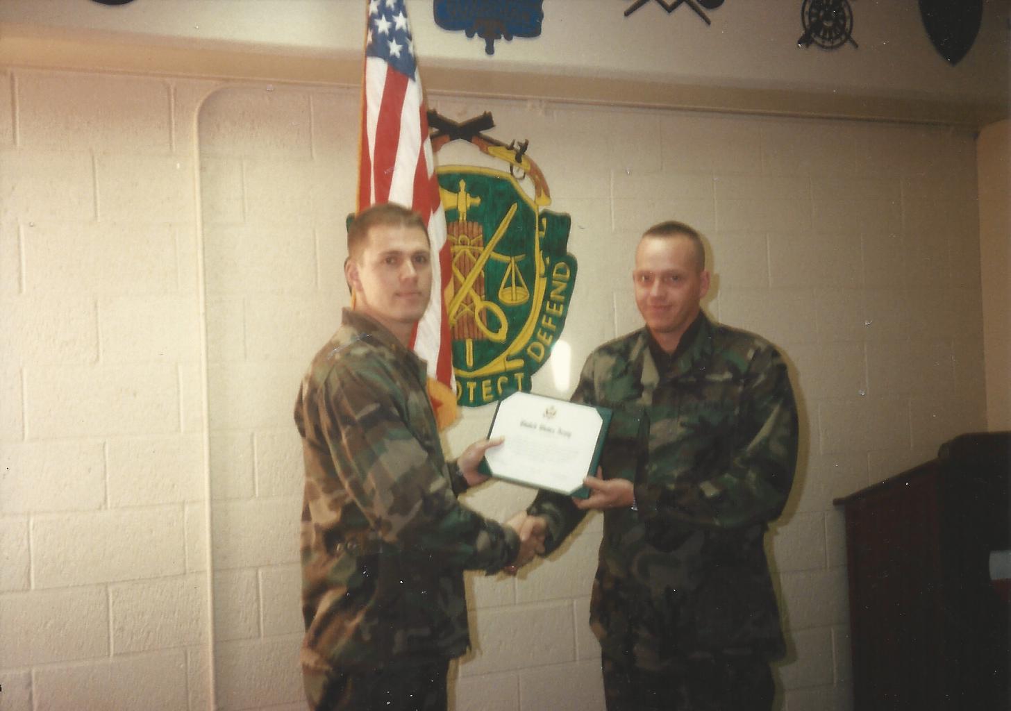 Michael reenelisting in 1997 at Fort Bliss.
